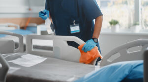 Nurse preparing hospital bed